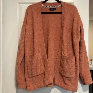 Pink fuzzy cardigan that you can dress up or dress